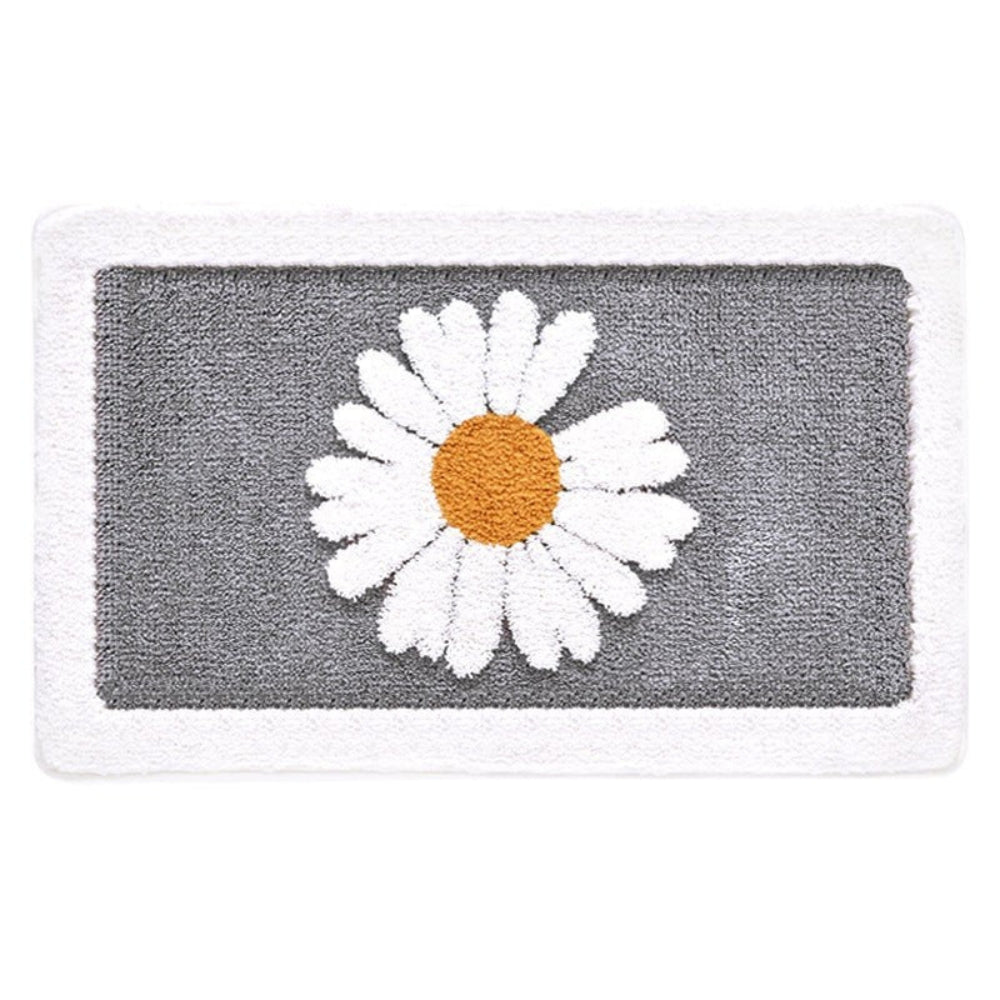 Gray bath mat with a white daisy design on a white background
