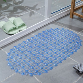 Blue bath mat on a tiled bathroom floor with green slides nearby.