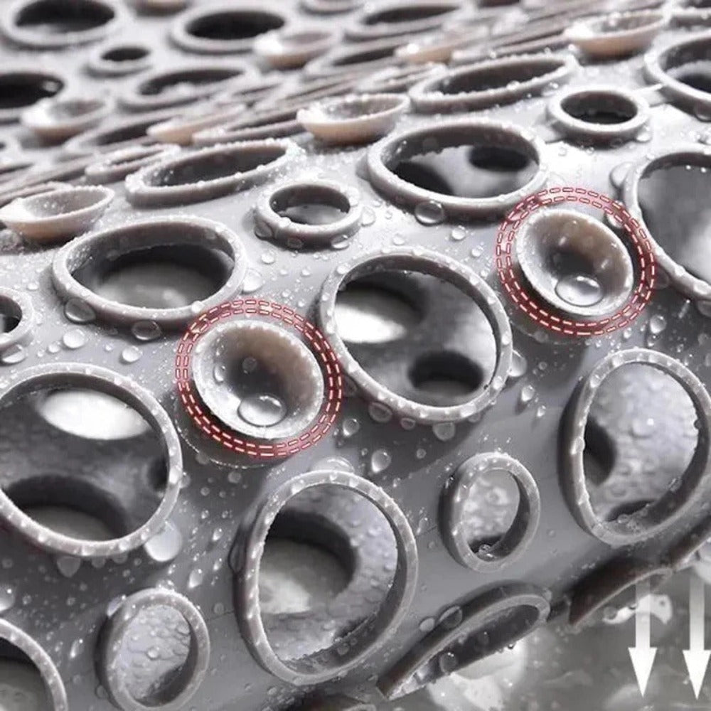 Close-up of a textured surface with circular patterns and water droplets.