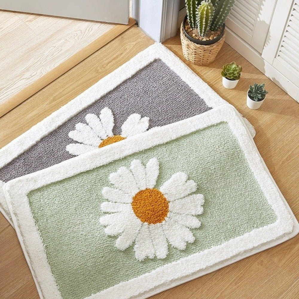 Doormat with daisy design on a wooden floor