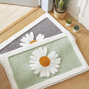 Doormat with daisy design on a wooden floor