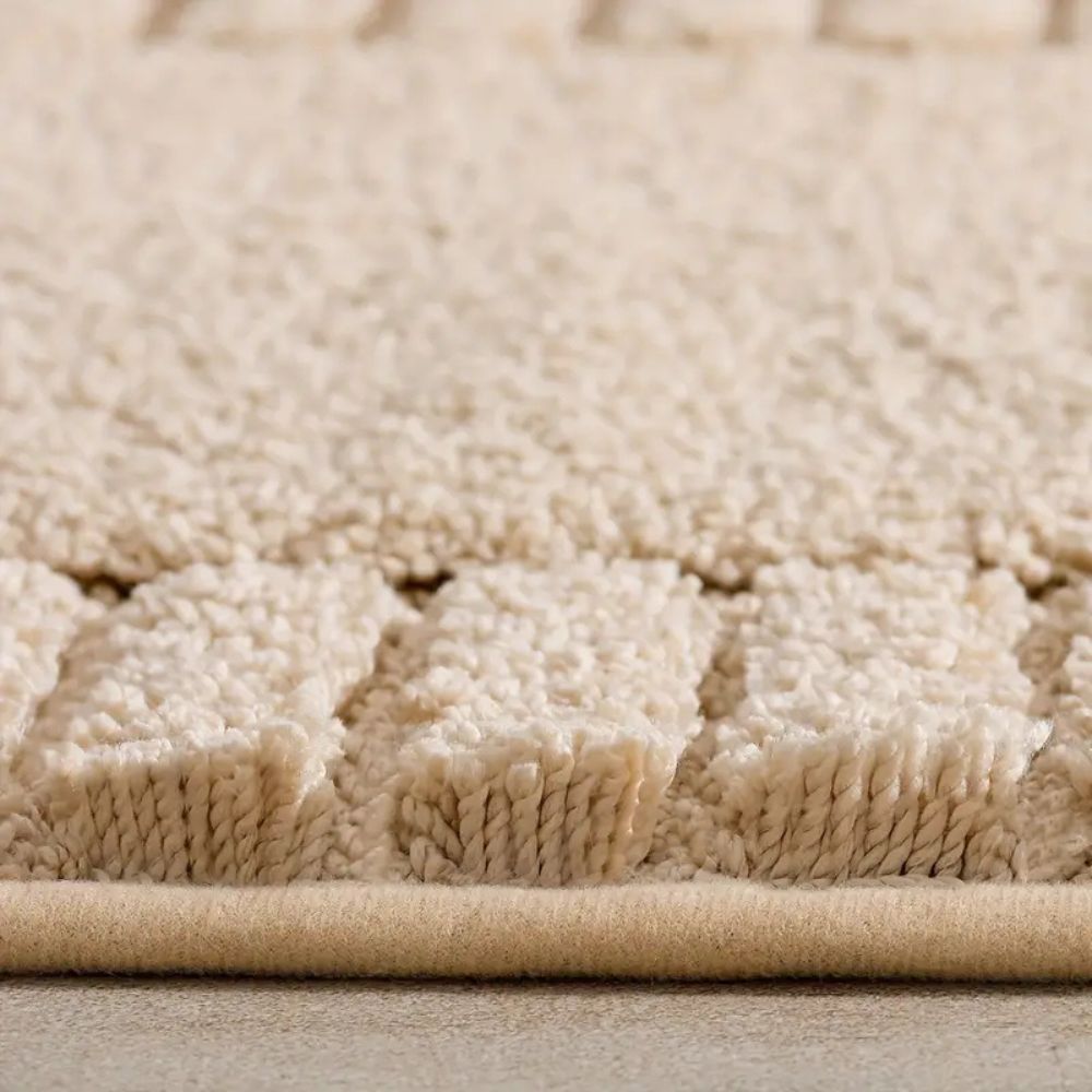 Close-up of a beige textured rug