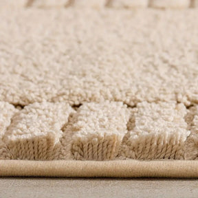 Close-up of a beige textured rug